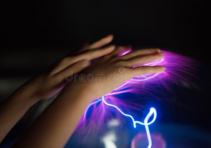 Child`s hands touching plasma globe. Plasma blast stock images, royalty-free photos and pictures