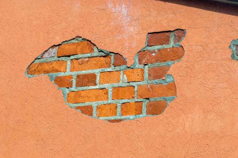 Plaster Falling Off the Wall of a Building. Facade Condition in Need of