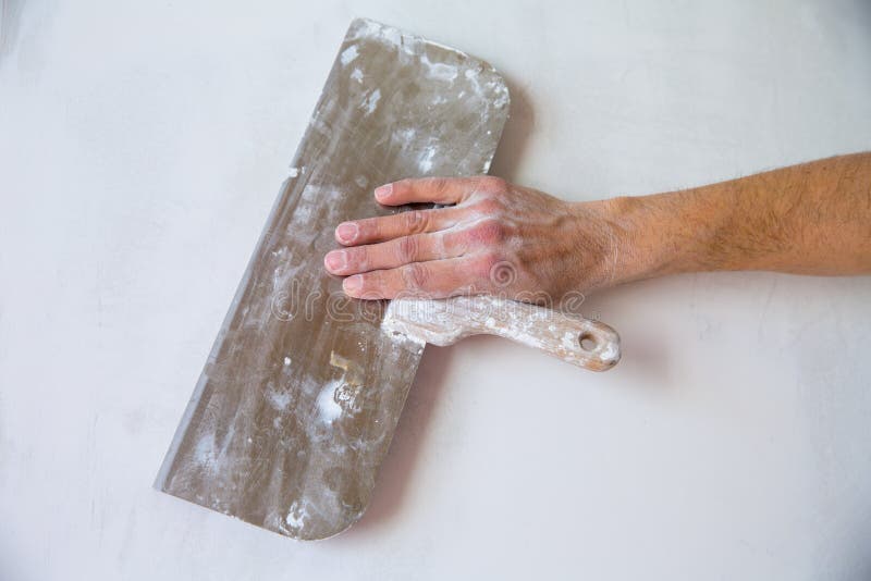 Plastering Wall with Plaste and Plaster Spatula Trowel Stock Photo