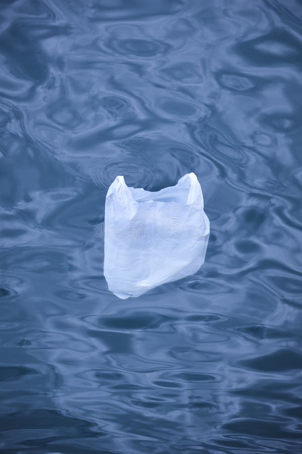 Plastic Bag Floating into the Sea. Environmental Damage Pollution
