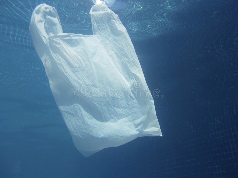 Plastic Bag Floating into the Water. Polluted Enviromental. Recycle