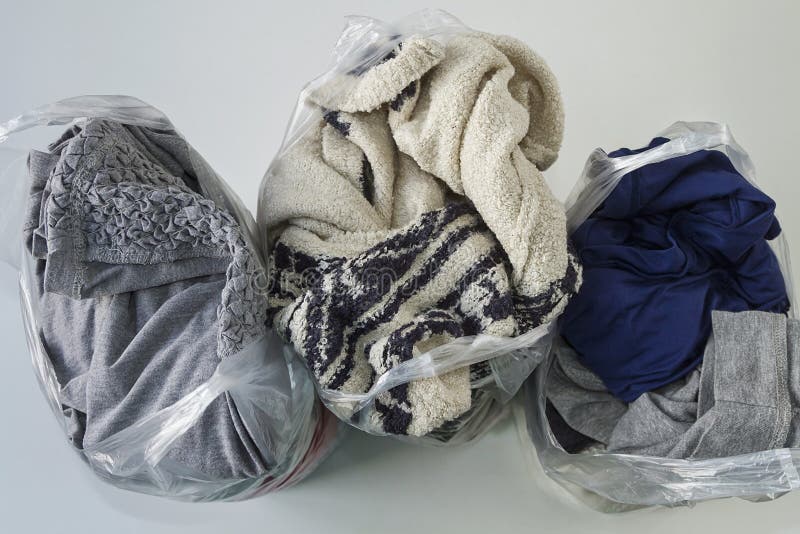 Clothes in plastic bags stock photo. Image of fabric 179130700