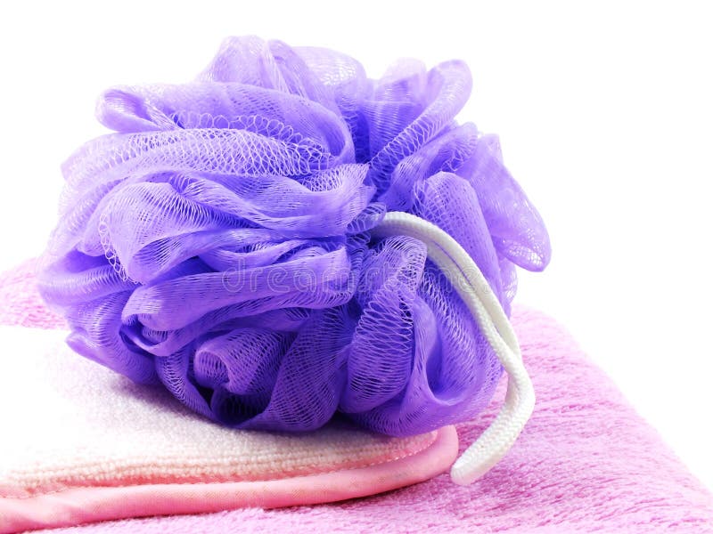 Plastic bath puff and towel royalty free stock photo