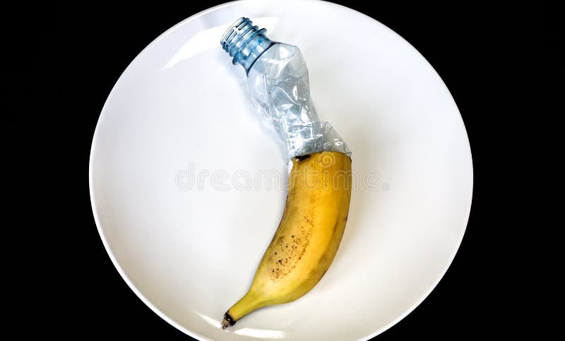 Plastic Bottle and Banana on the Plate. People Eating Polluted Food ...