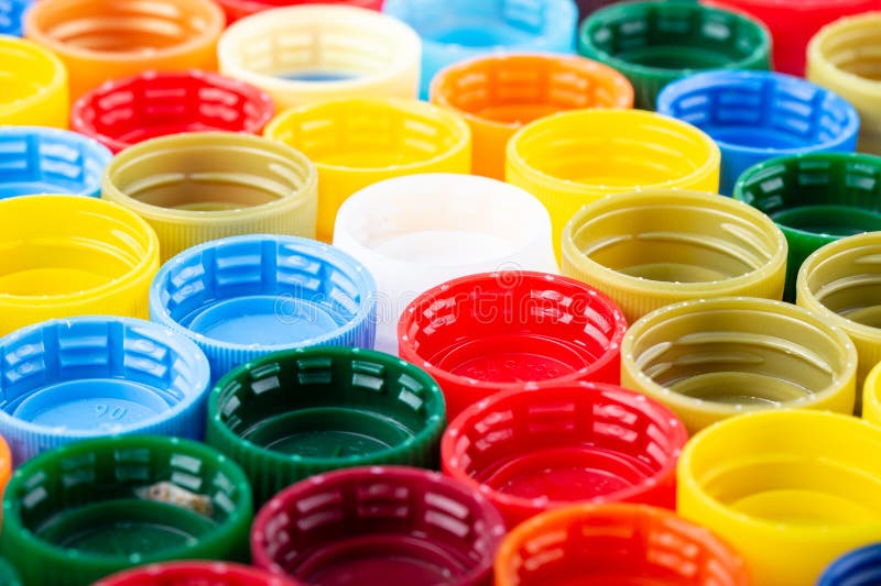Plastic Bottle Caps Background. Cap Material is Recyclable Stock Photo