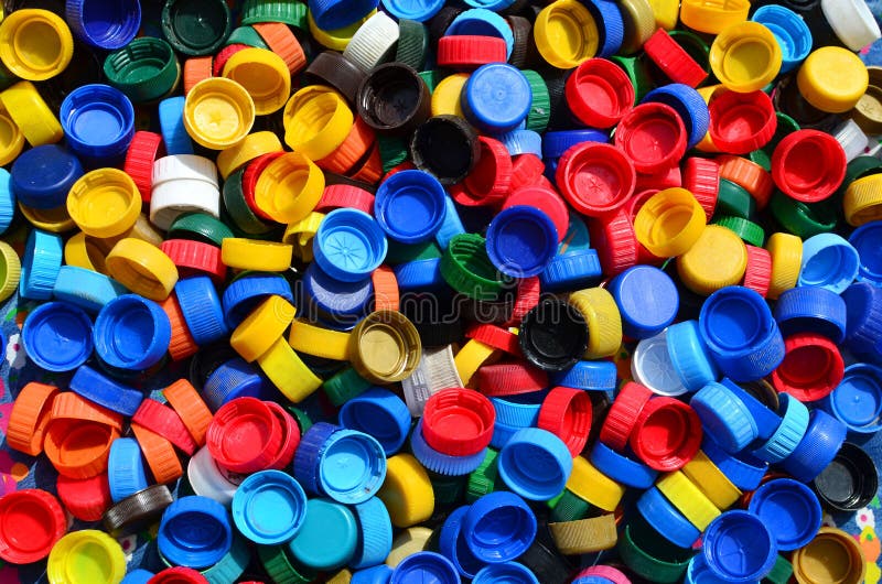 Plastic Bottle Caps Background. Cap Material is Recyclable.Remove Lids from Plastic Bottles