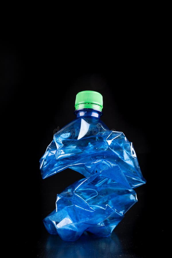 Plastic Bottle on a Dark Table. Plastic Container for Drinking Water