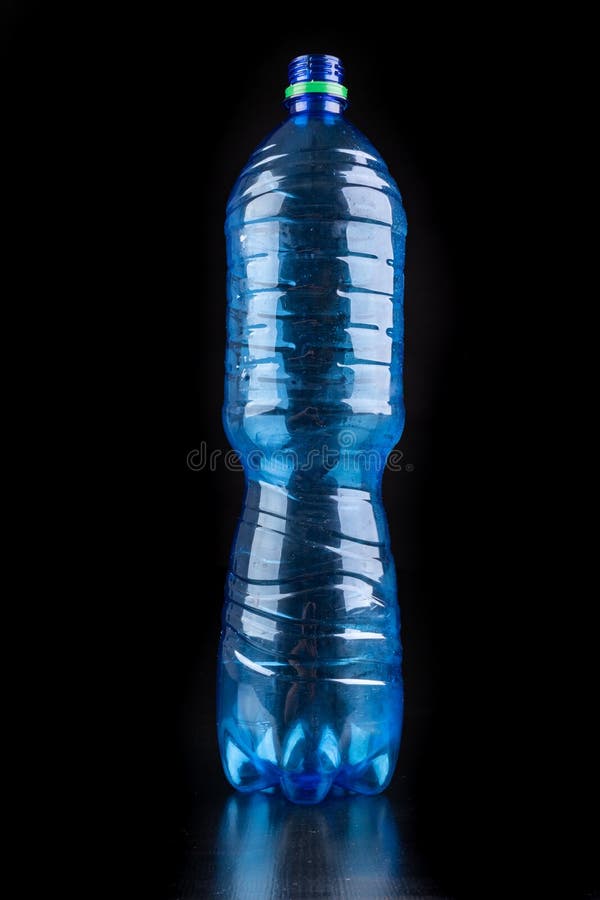 Plastic Bottle on a Dark Table. Plastic Container for Drinking Water