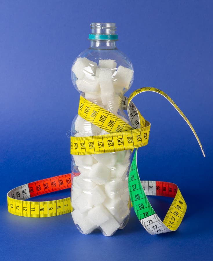 Plastic Bottle Filled with Sugar Cubes and a Measuring Tape Around it