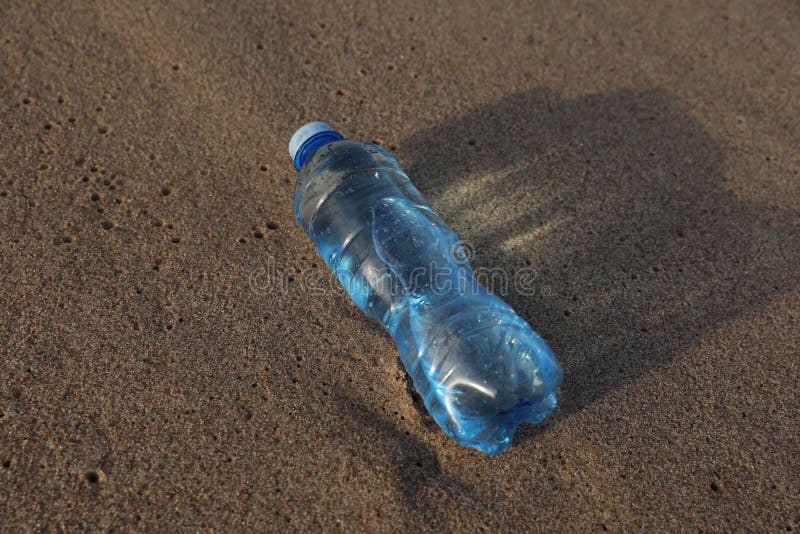 Plastic Bottle of Fresh Water on Wet Sand Stock Photo Image of
