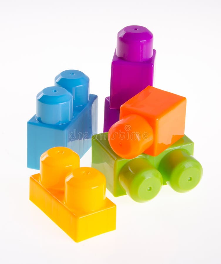 Plastic building blocks or colour blocks on a background.