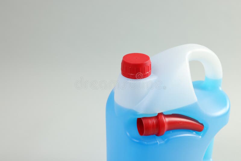 Plastic Canister with Nozzle and Blue Liquid on Light Grey Background
