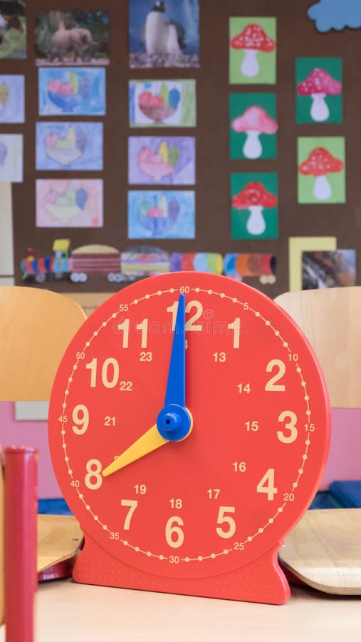 Plastic Children`s Clock in the Classroom Interactive Hours Stock Image - Image of classroom, equipment: 200911505