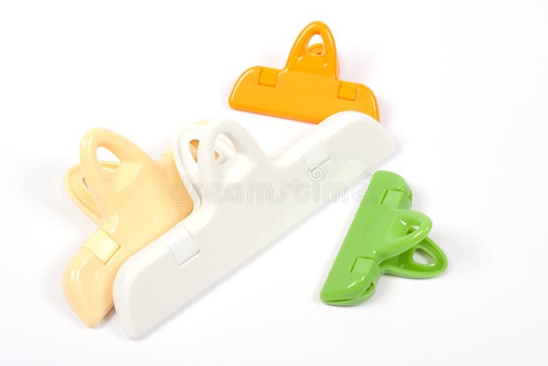 Plastic clips over white stock image. Image of cutout 13004869
