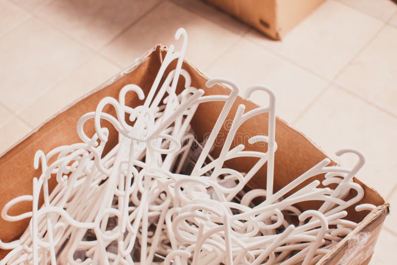 Plastic clothes hangers stock photo. Image of organizing 90968782