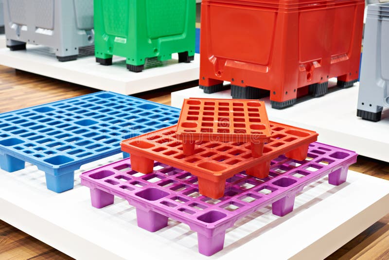 Plastic colored pallets at store royalty free stock photo