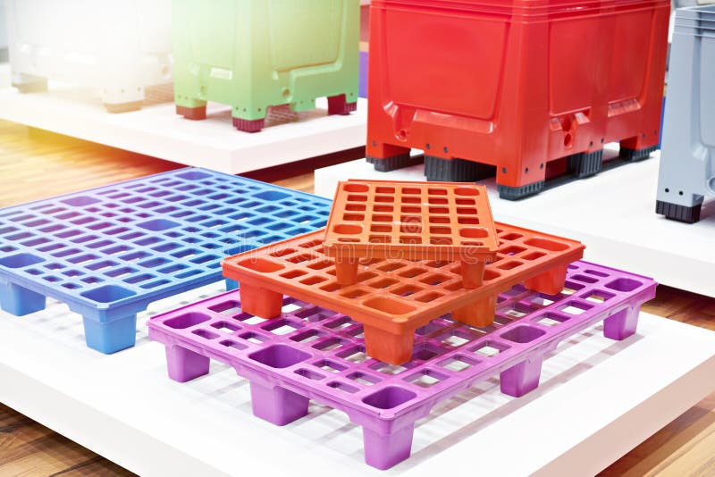 Plastic colored pallets at store stock image
