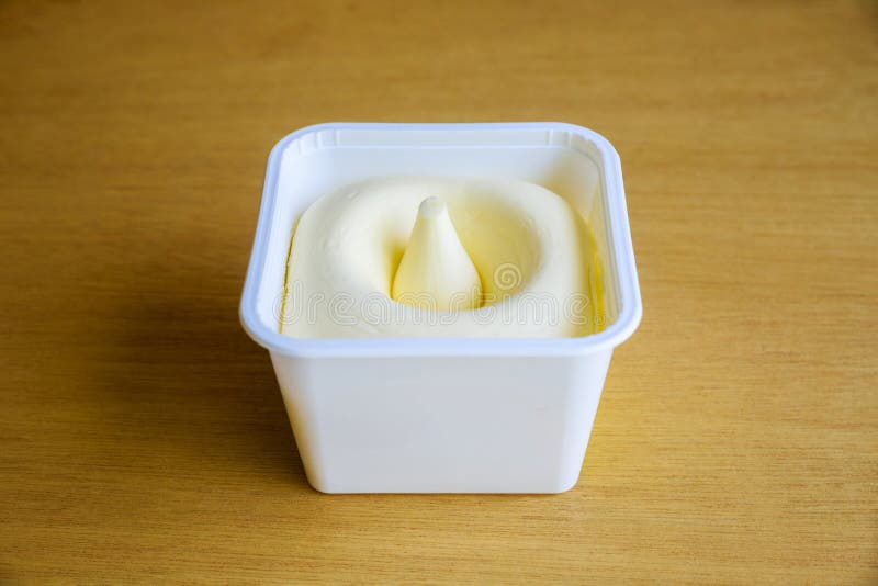 Plastic Container Contains Whipped Creamy Butter. Stock Photo Image