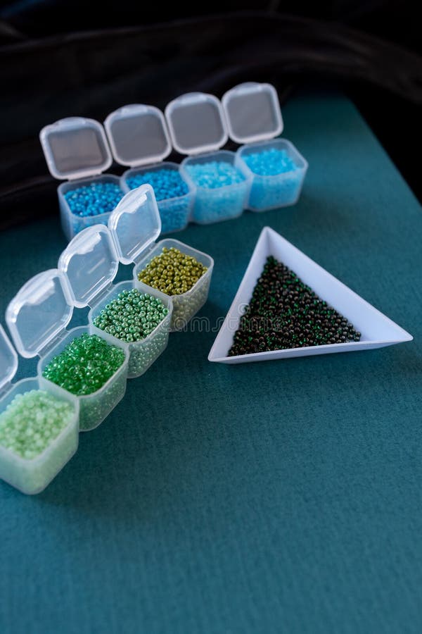 Plastic Containers are Filled with Different Colored Beads Stock Photo