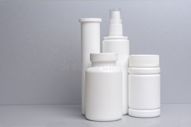 4 Plastic Containers for Medicines and Vitamins, a Bottle with a Spray