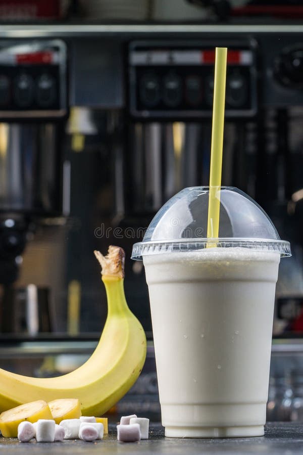 https://thumbs.dreamstime.com/b/plastic-cup-milkshake-banana-color-wooden-background-plastic-cup-milkshake-banana-121685658.jpg