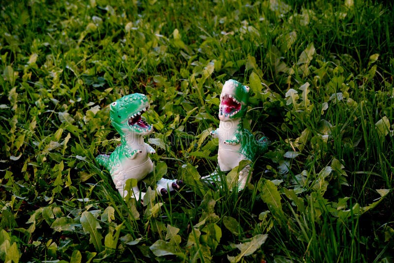 Plastic Dinosaur Toy Pictured at a Backyard Stock Photo Image of