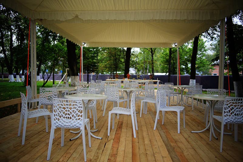 Plastic furniture in cafe stock image. Image of armchair 65989171