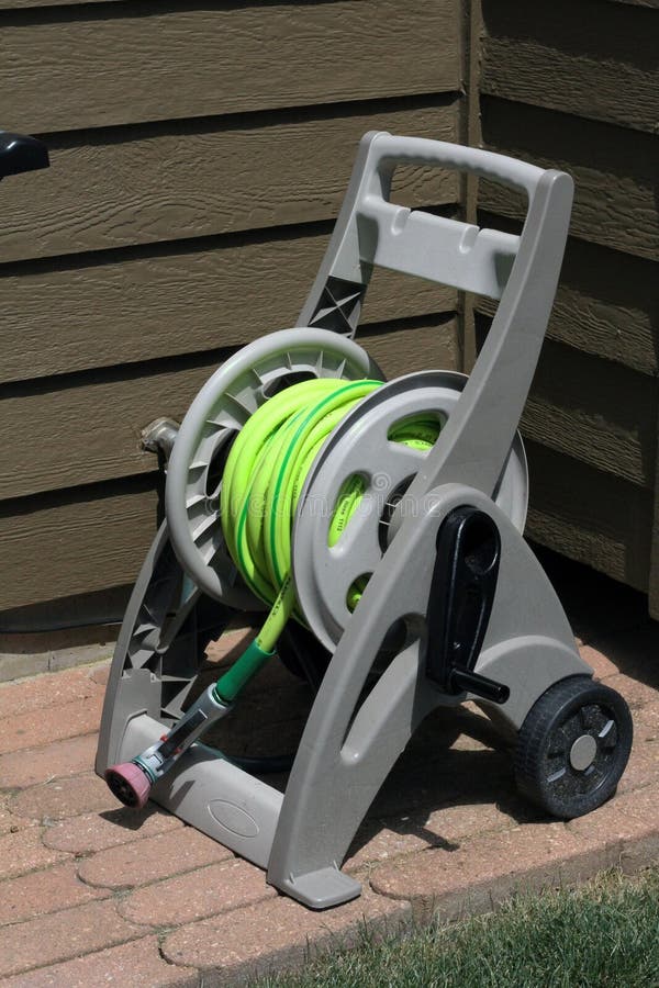 Plastic Garden Hose Reel Cart with Wheels Stock Image - Image of