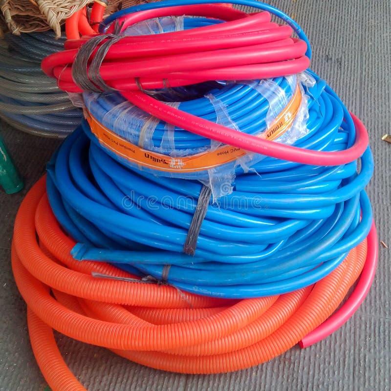Plastic Garden Hose, Water Hose. in Front of Hardware Store Stock Image