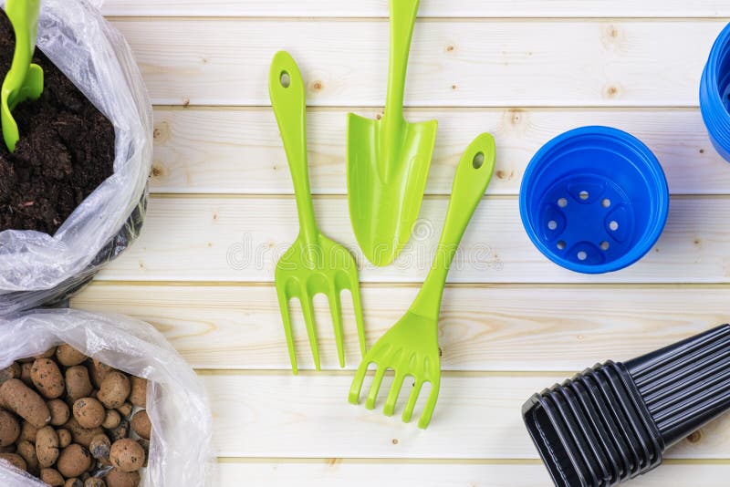 Plastic Garden Tools - a Shovel, a Rake and Plastic Containers for ...