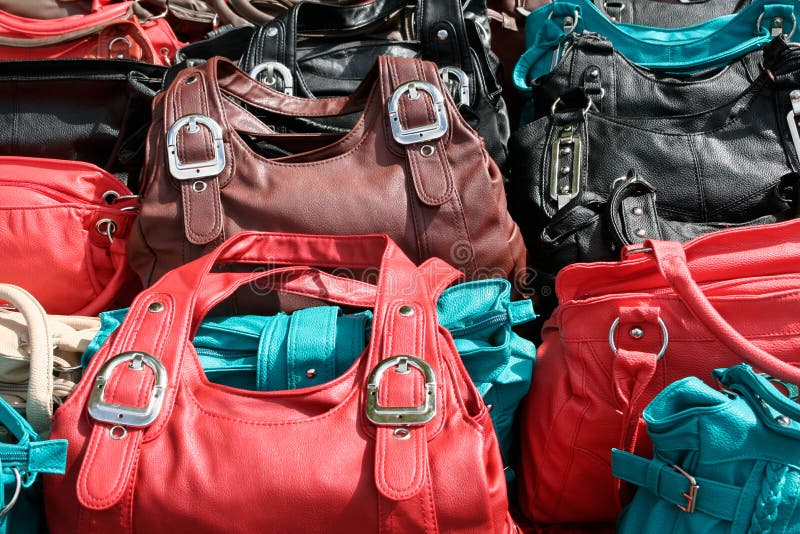 Pile of used worn secondhand bags handbags for sale Stock Photo