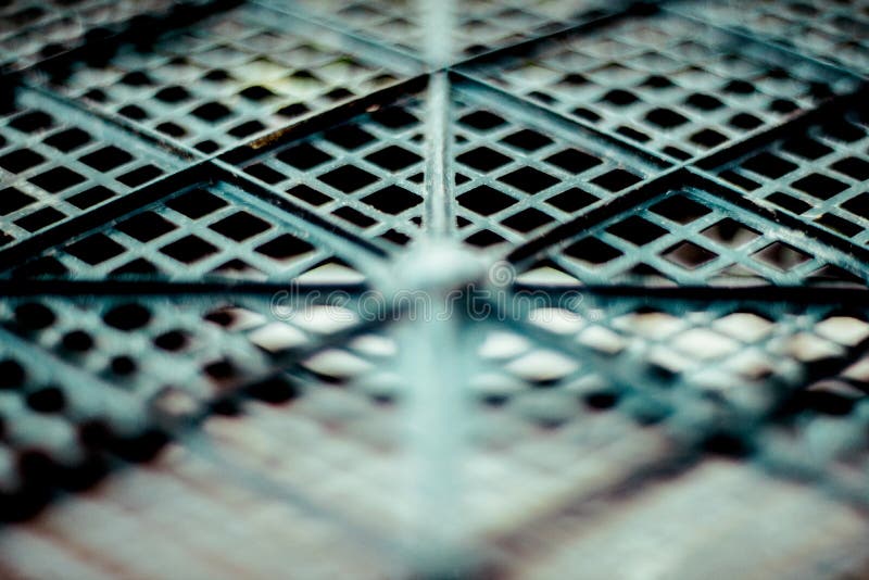 Plastic mesh, texture of black geometrical surface with depth of field stock image