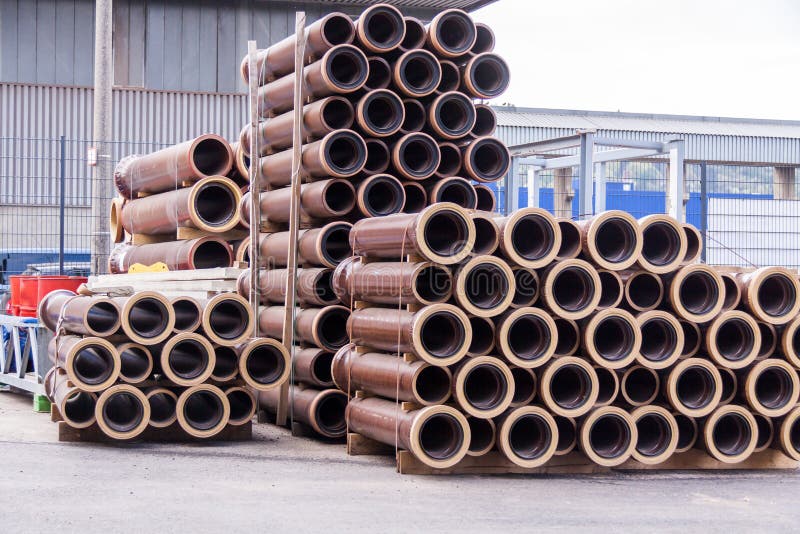 Plastic pipes in a factory or warehouse yard. Stack, piping.
