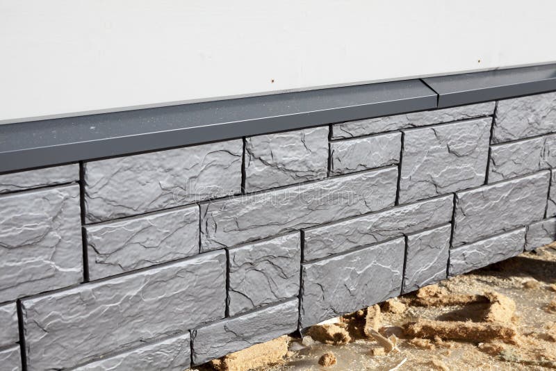 Plastic Plinth Panels with a Metallic Sheen, House Base Stock Photo