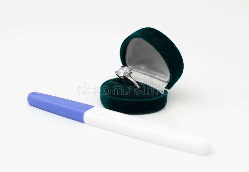 Plastic Pregnancy Test and Wedding Ring. Stock Image Image of married