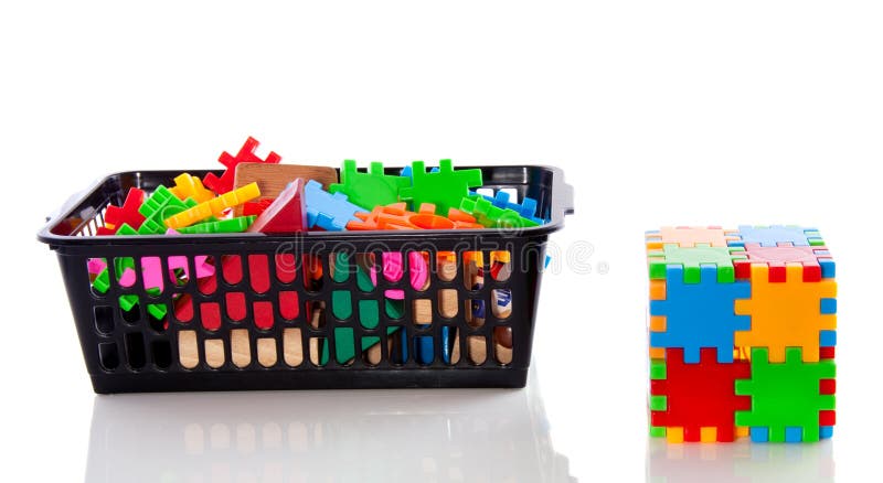 A plastic puzzle cube and pieces