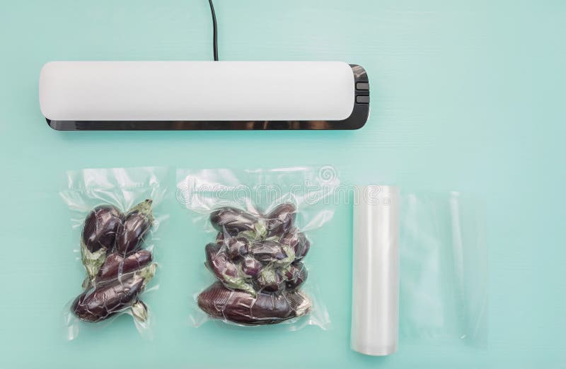 Plastic Sealing Machine. Vacuum Packaging of Fresh Tomatoes. Vacuum