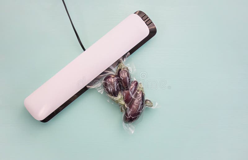 Plastic Sealing Machine. Vacuum Packaging of Fresh Tomatoes. Vacuum