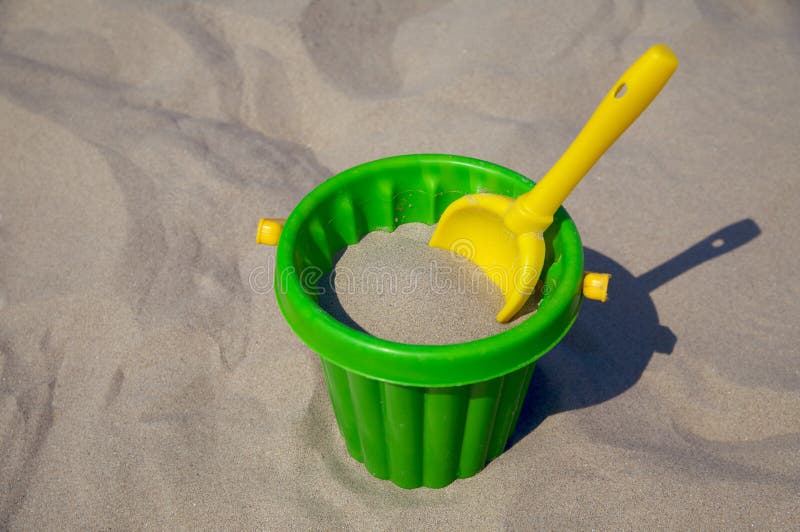 Plastic Spade and Bucket in Sand Stock Photo Image of bucket, childhood 10673812