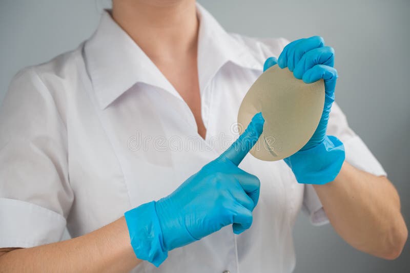 A Plastic Surgeon Shows a Breast Silicone Implant. Stock Image Image of patient, anatomy