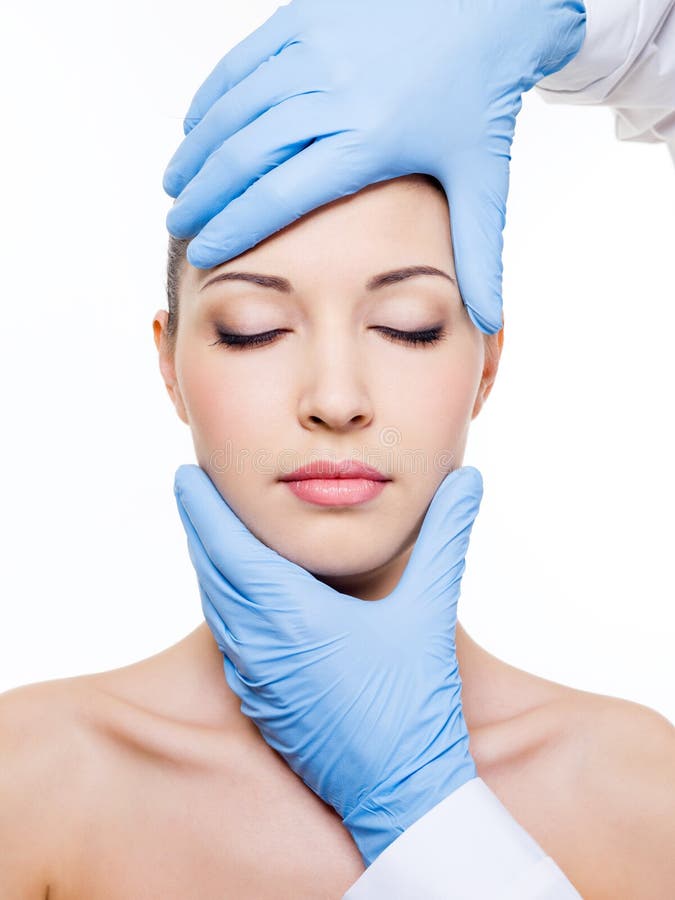 Plastic surgery touching female face stock photo