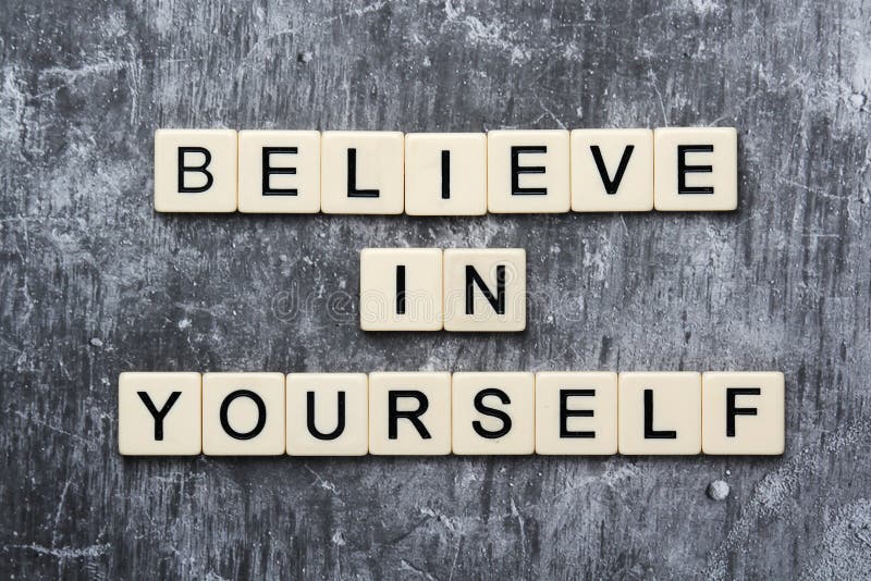 Letters forming a motivation phrase Believe in yourself stock photos