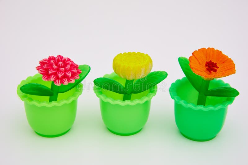Plastic toy flowers stock photo. Image of yellow, plastic 134826058