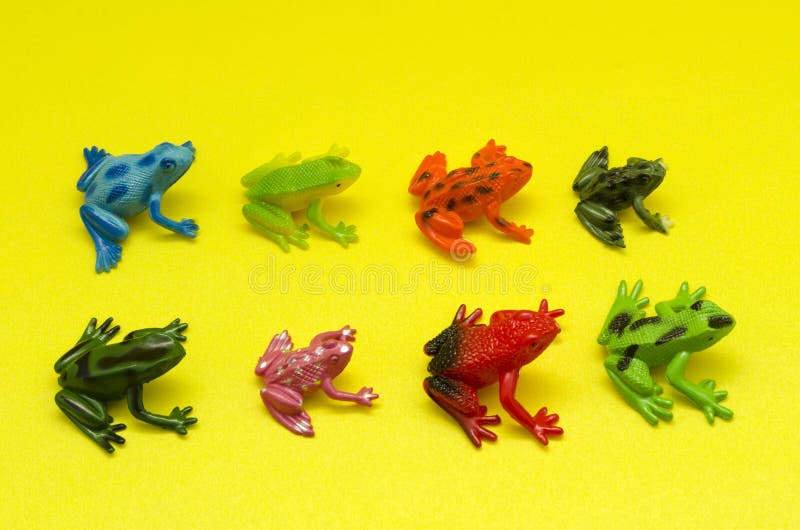 Plastic Toy Frogs Against Yellow Background Stock Photo - Image of play,  amphibian: 126481452