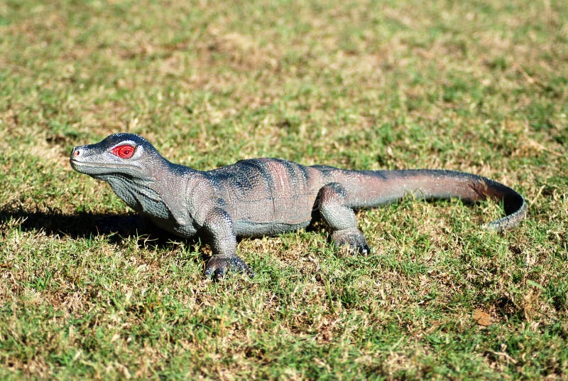 Plastic toy lizard stock image. Image of side, grass, field 4760641