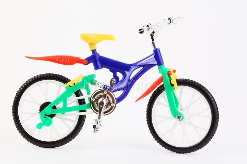 Plastic toy two-wheeled bicycle on white