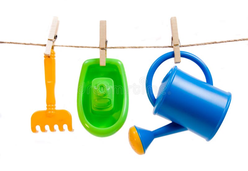 Plastic toys hanged with clothespins royalty free stock photo