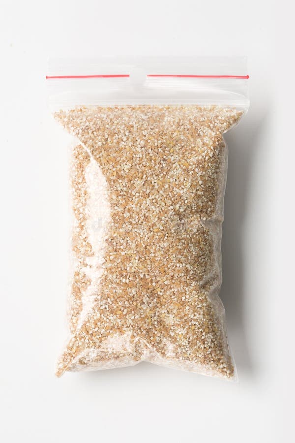 Download Plastic Transparent Zipper Bag With Full Raw Wheat Grits Isolated On White, Vacuum Package ...