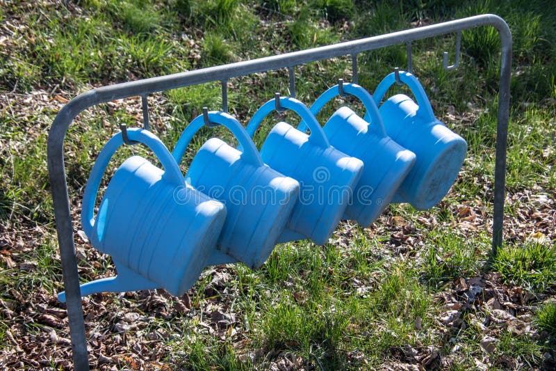 Plastic Watering Cans are Hung Stock Photo Image of injection, water
