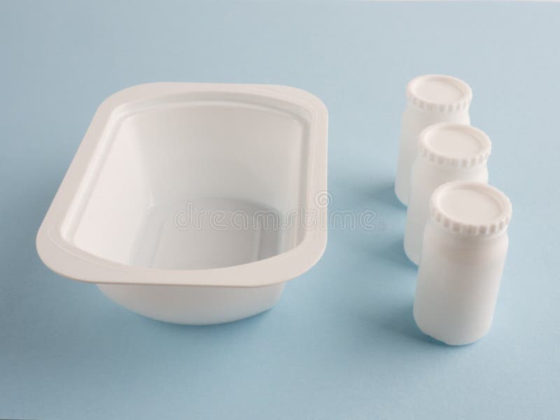 Plastic White Bank And Three White Banks With Lids Stock Photo Image